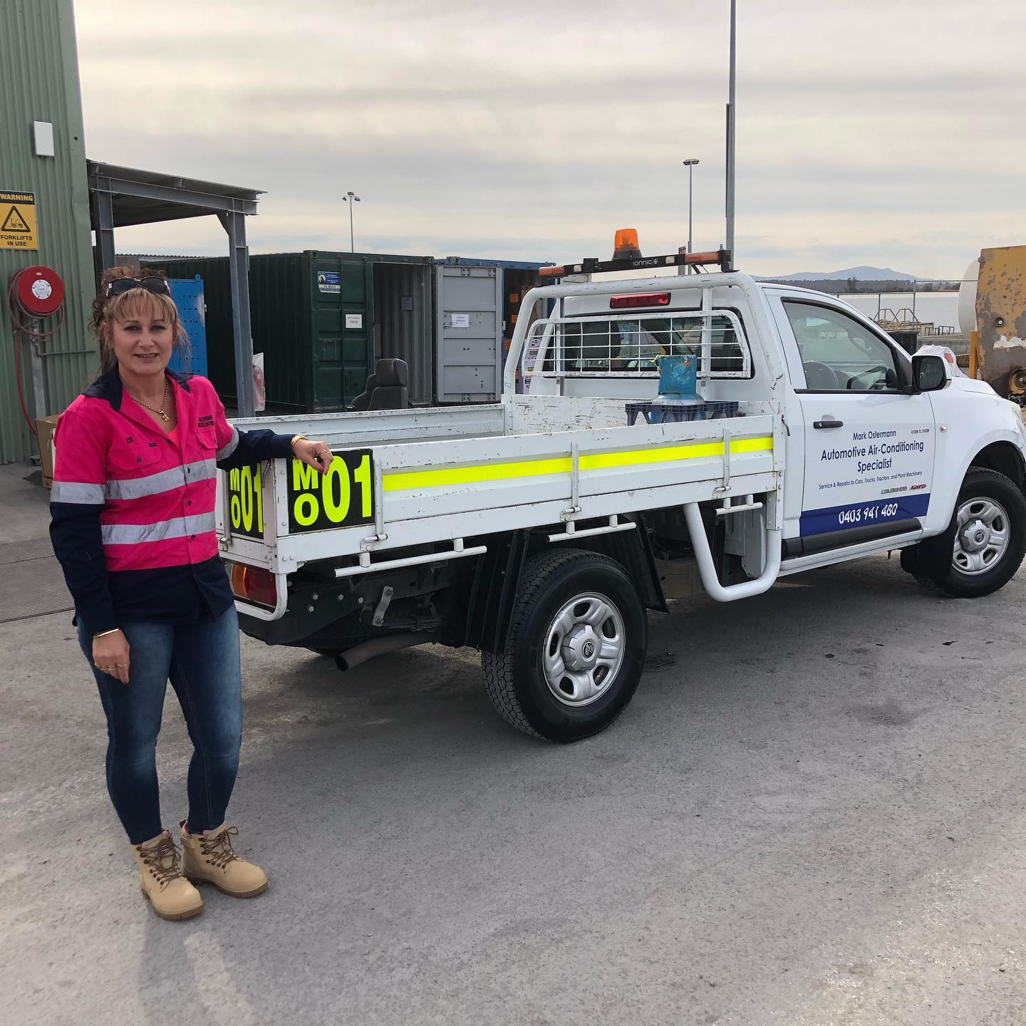 The signwritten service ute in an industrial yard